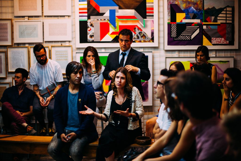people sitting in a room talking