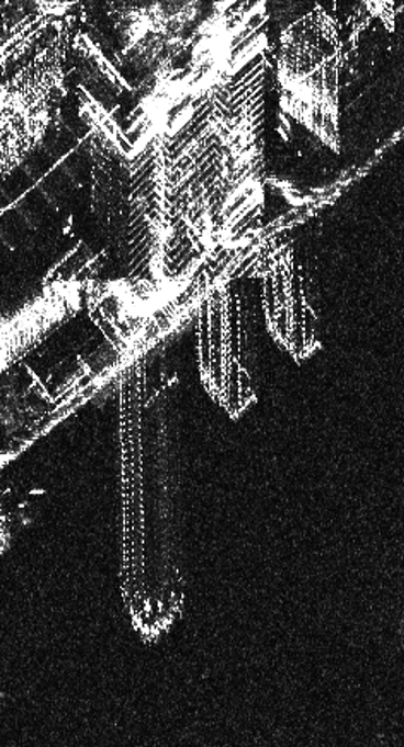 The process of capturing SAR data can cause tall objects to appear distorted.